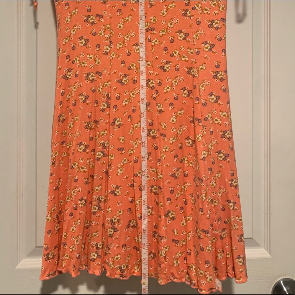 Love Fire dress. Color listed as coral ditsy. Size medium. Tags still attached.